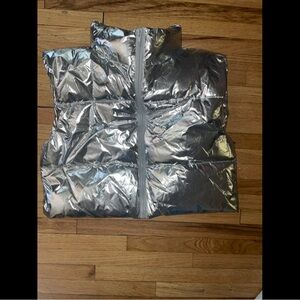 Silver and stylish metallic vest.